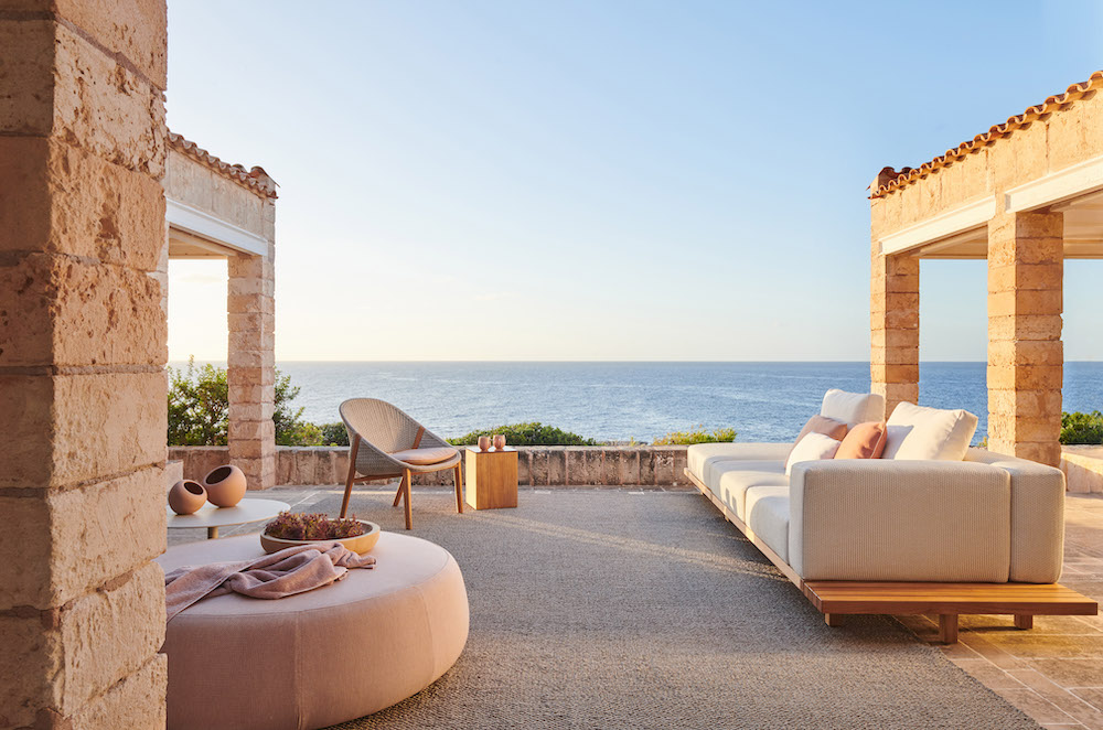 outdoor patio with modern white sofa outdoor furniture at coastal home by Studio471