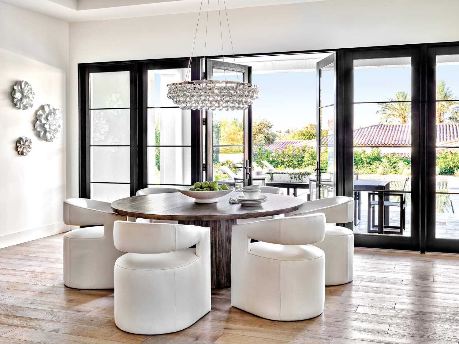 A breakfast nook with glass-and-steel...