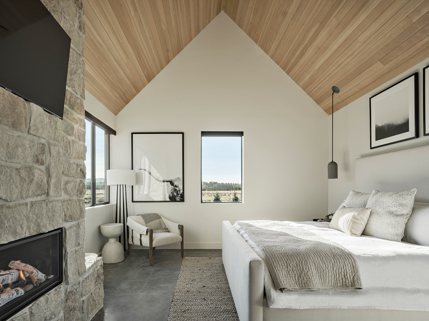 neutral bedroom with limestone floor,...