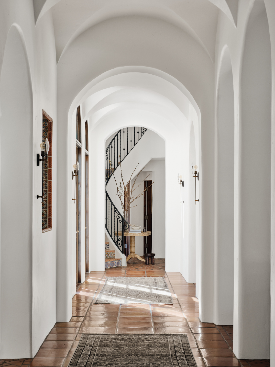 Hallway with Spanish tile floors,...