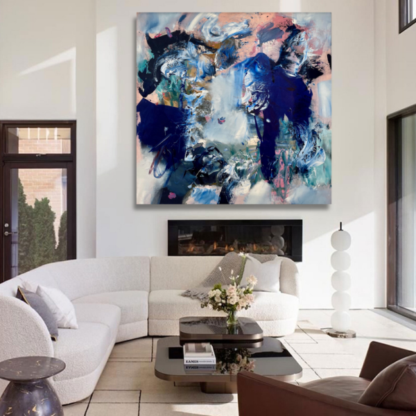 white room with a colorful abstract art piece from MASH Gallery on the wall in Los Angeles home's living room with white sofa and modern accents