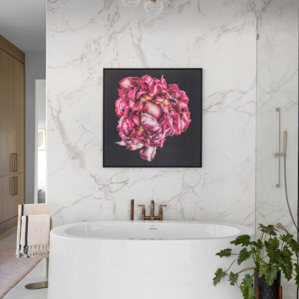 Porcelain Bathroom with pink flower wall art and gold fixtures by Construction Resources in Georgia