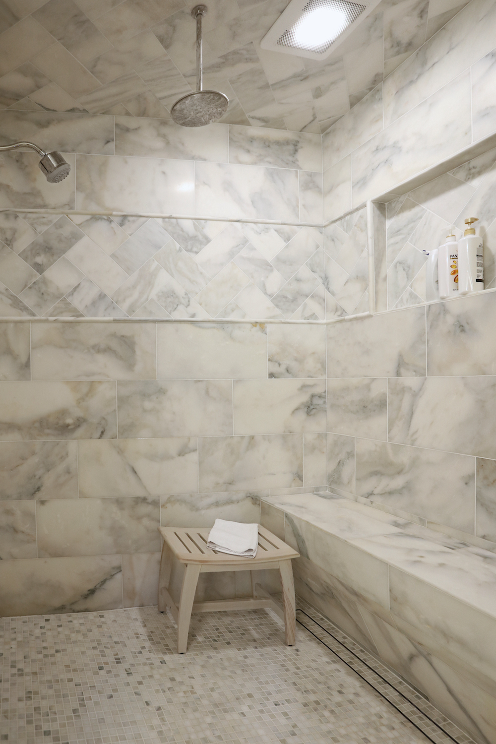 white marble tile show with silver fixtures by Construction Resources in Georgia