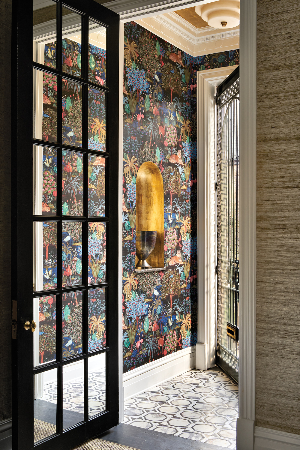 foyer with bold floral wallpaper...