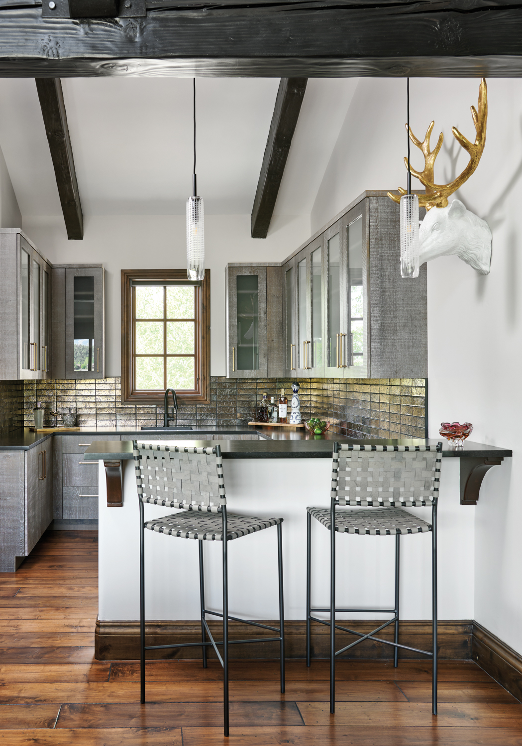 Kitchen with silver-tile backsplash, black-metal...