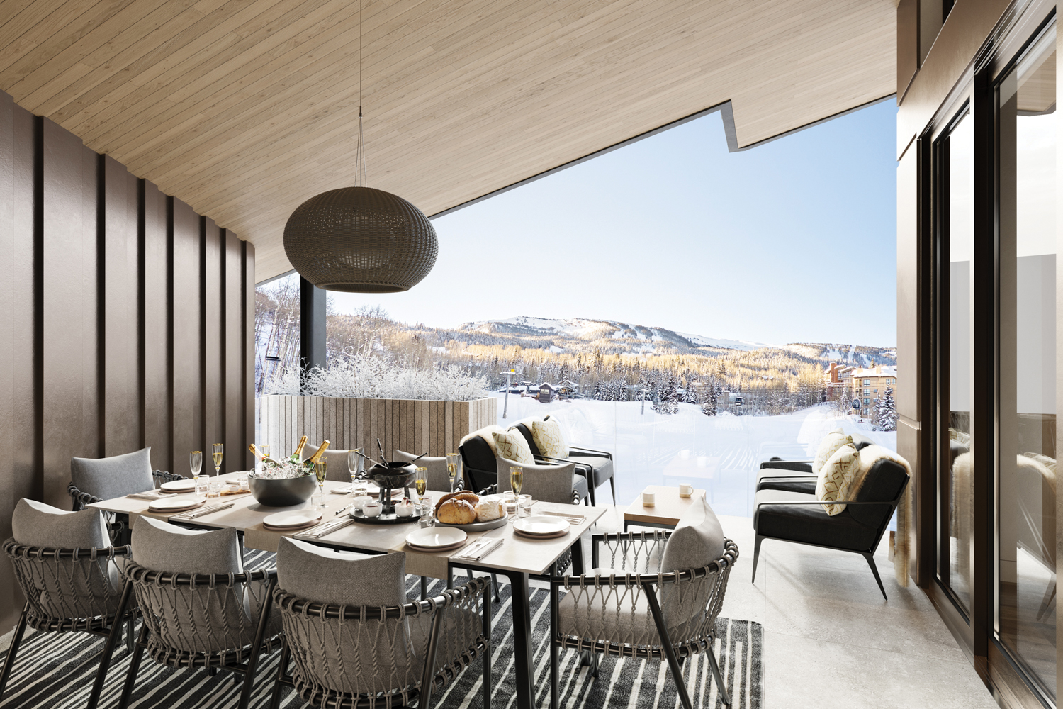 Aura Snowmass outdoor patio with dining table and chair with ski slope views