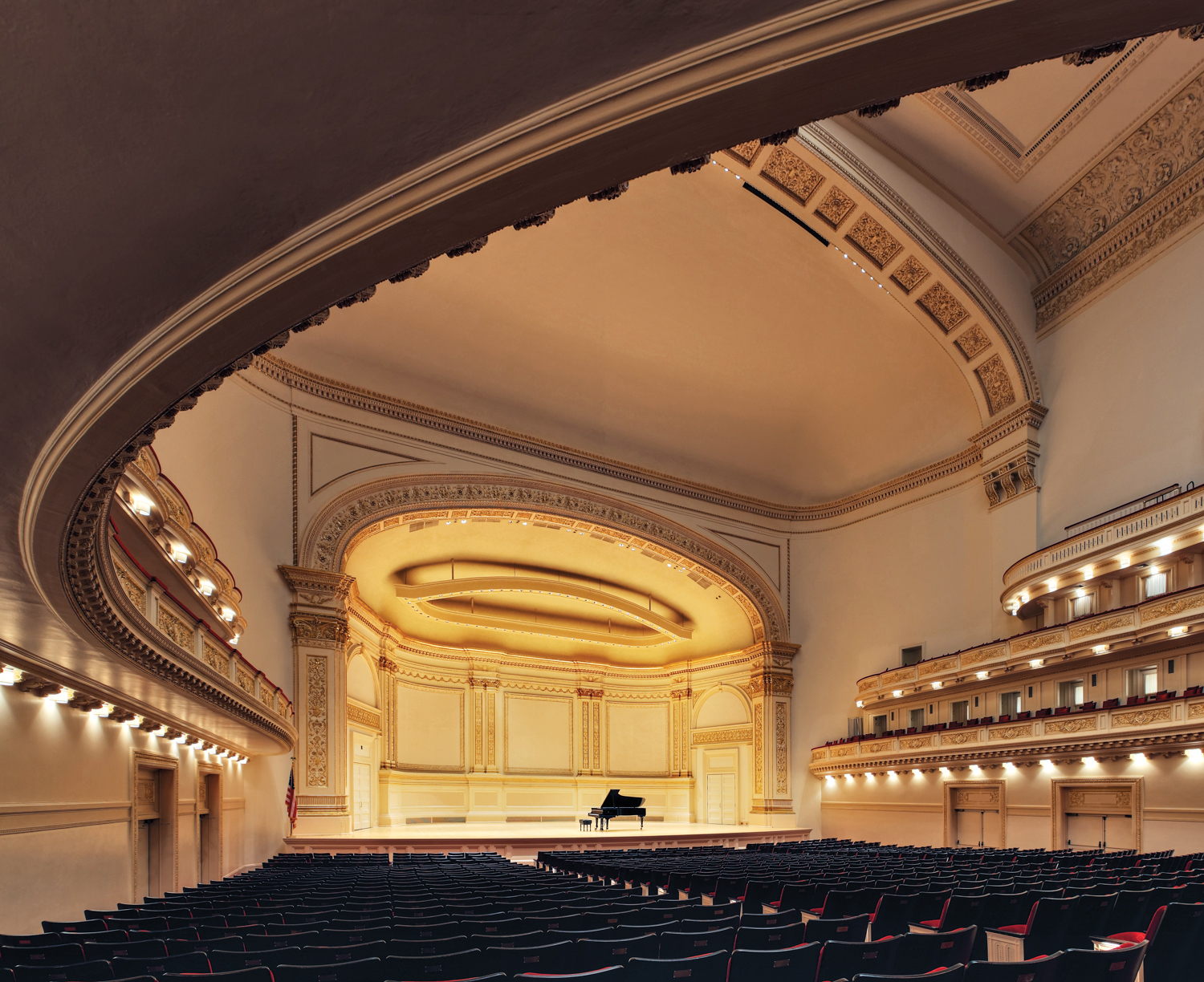 Carnegie Hall seating and stage in warm light