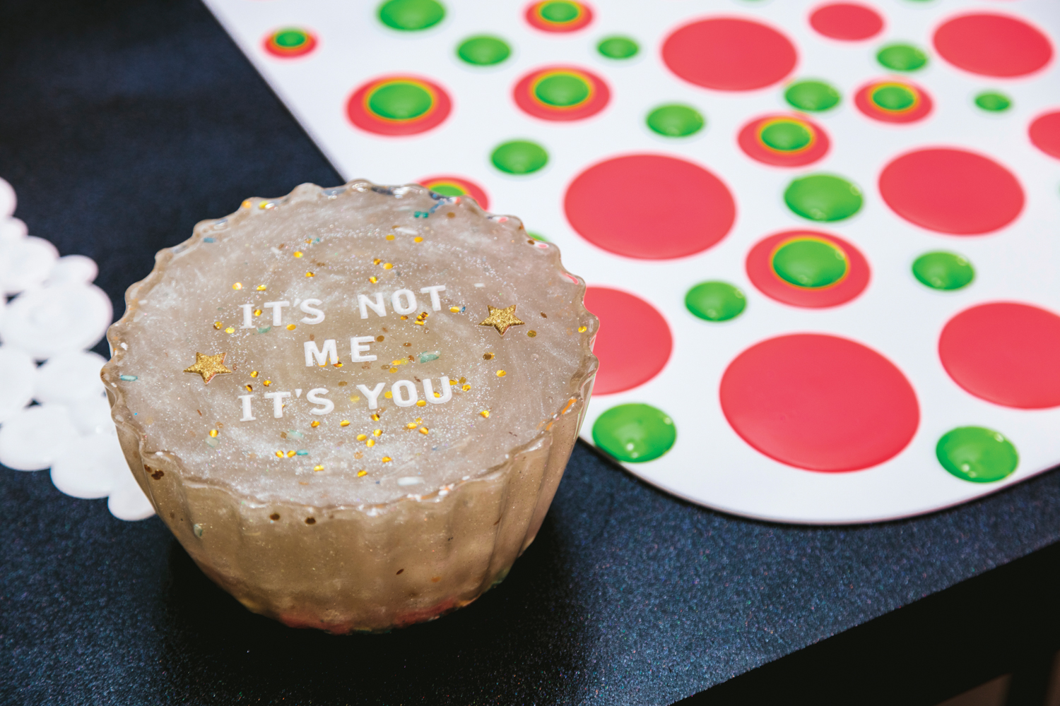 faux cupcake with saying on it next to one of jillian whelan's 