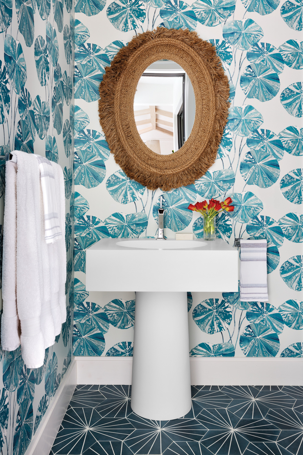 guest bathroom with teal tropical...