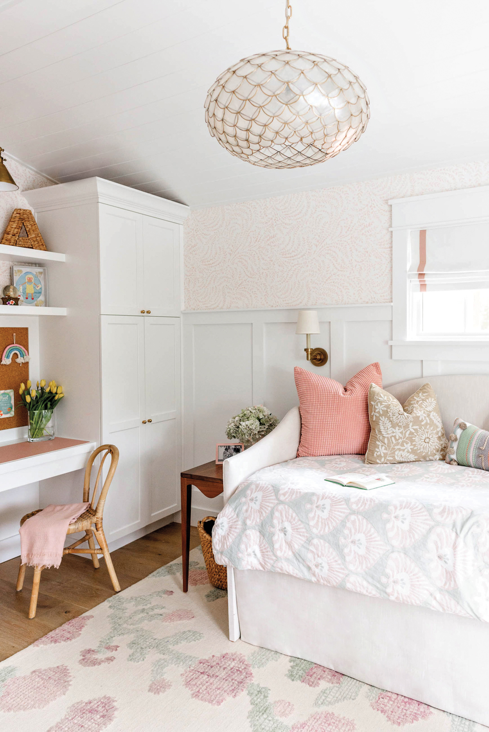 bedroom with light pink patterned...