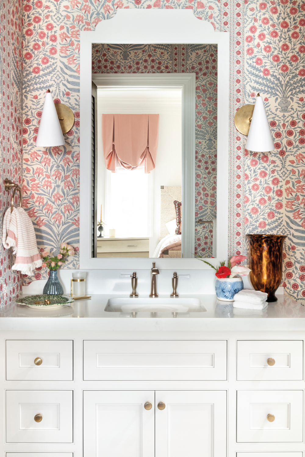 guest bathroom with pink patterned...