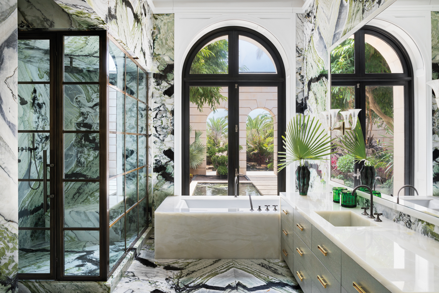 bathroom with marble walls and...