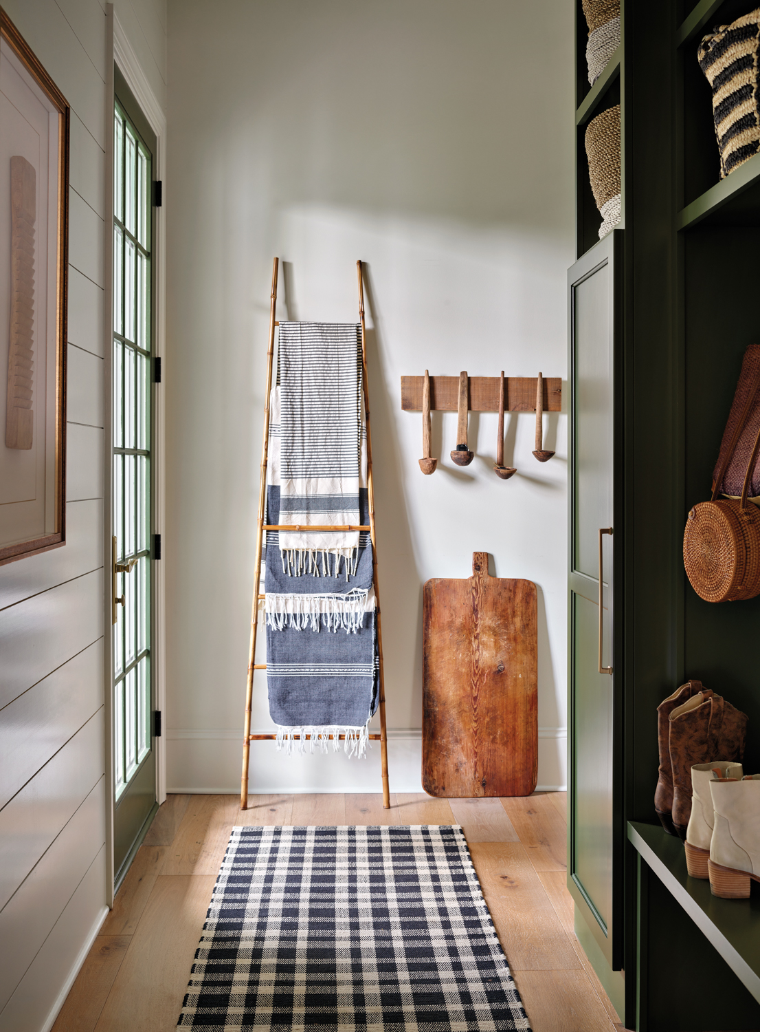 Back entryway with plaid rug,...