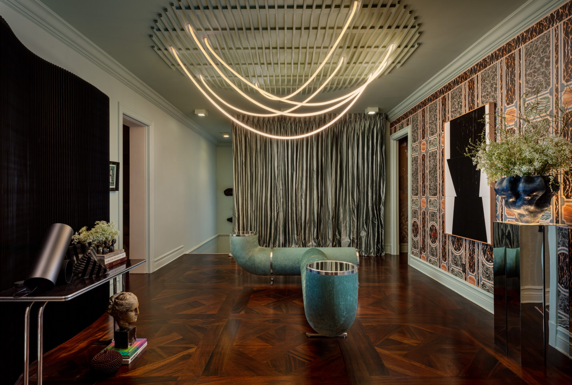 room with custom pipe tunnel bench and large sculptural lamp at Kips Bay Palm Beach