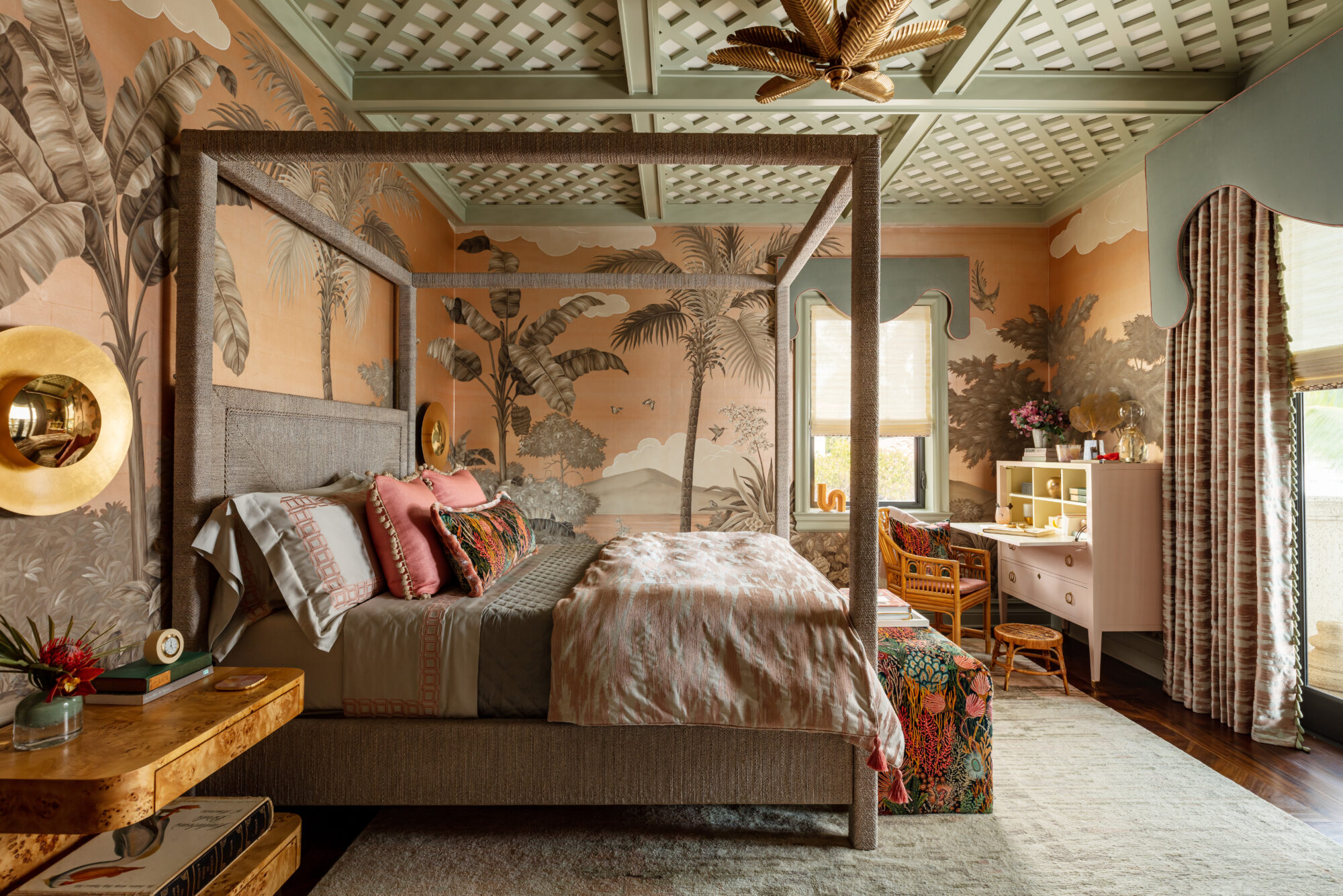 jungle-inspired bedroom with palm-tree inspired wallpaper and chandelier