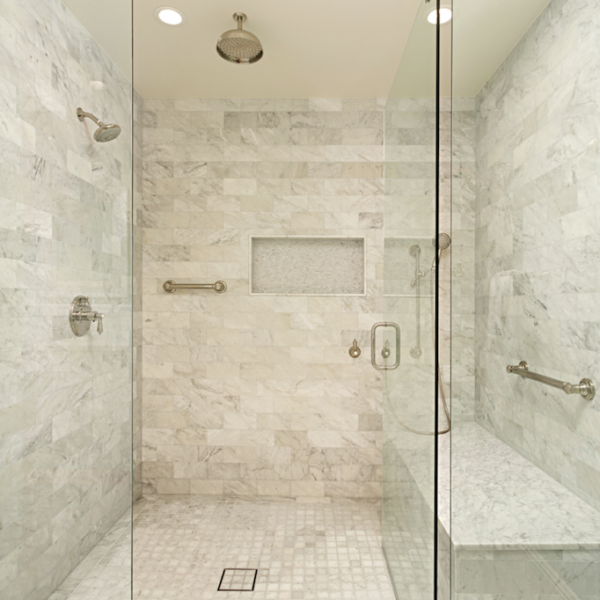white tile shower in a Southern California home's primary bath by Coastal Home Design Studio
