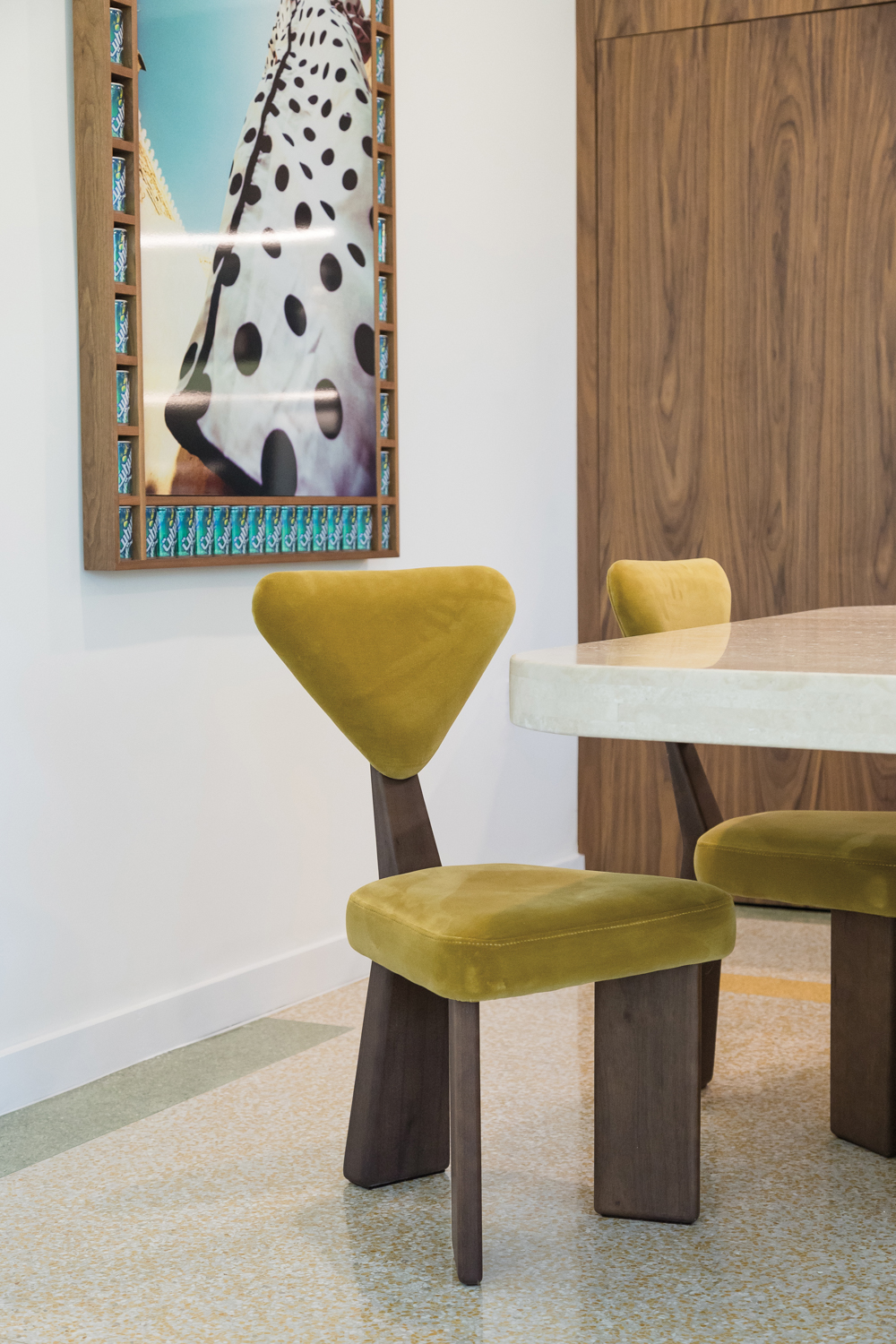 Two geometric dining chairs covered in yellow-green velvet material in Tatiana Seikaly's feed