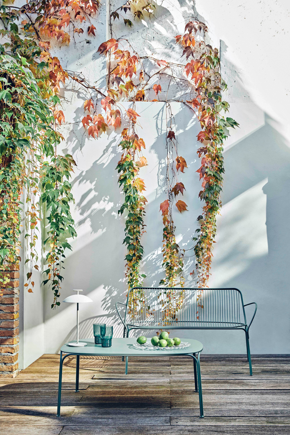 South Florida shop Kartell displays an outdoor couch and table against a white wall