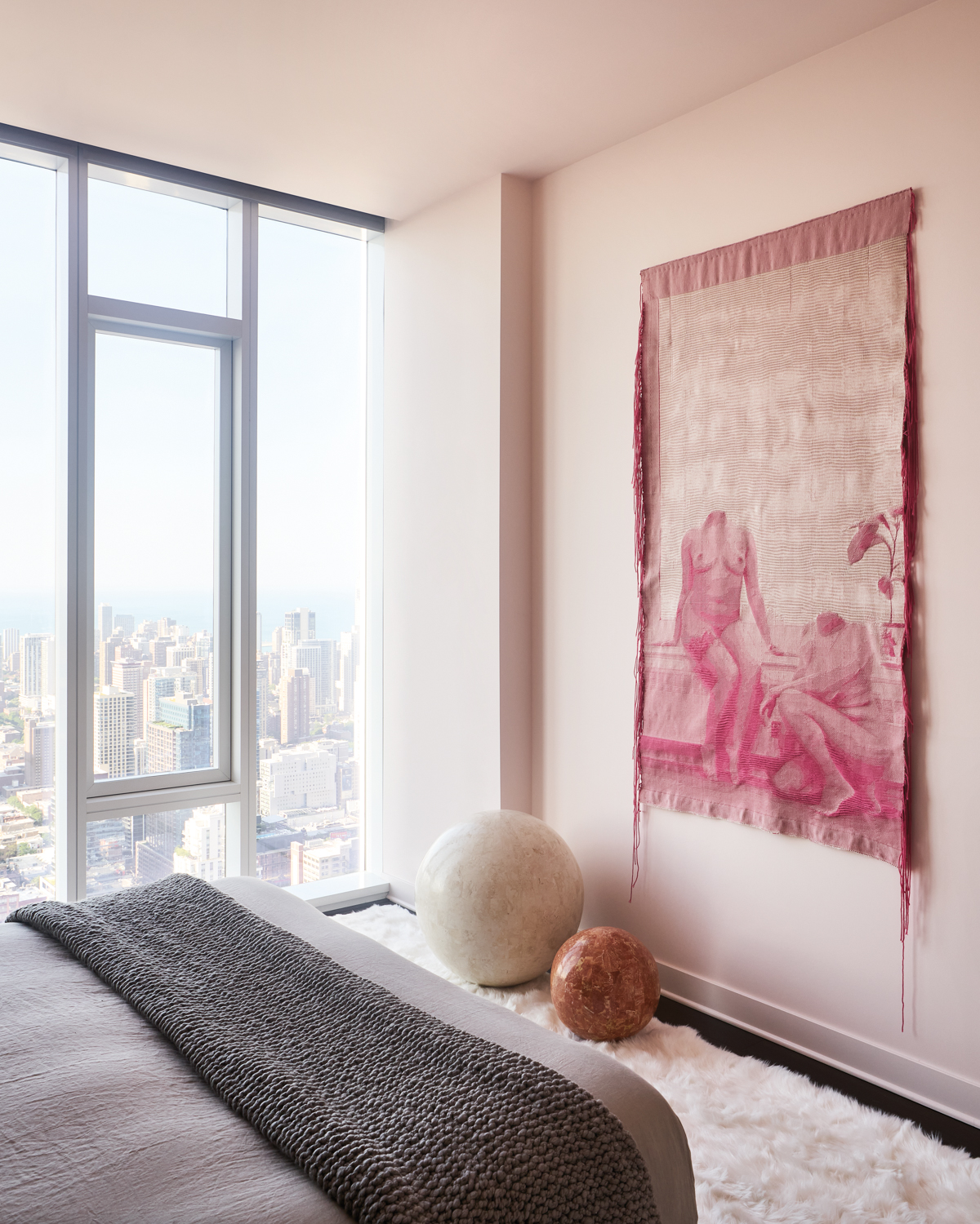 A pink woven tapestry with...