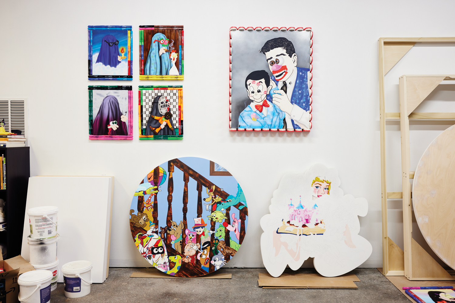 Grouping of cartoon paintings in an art studio by Griffin Goodman