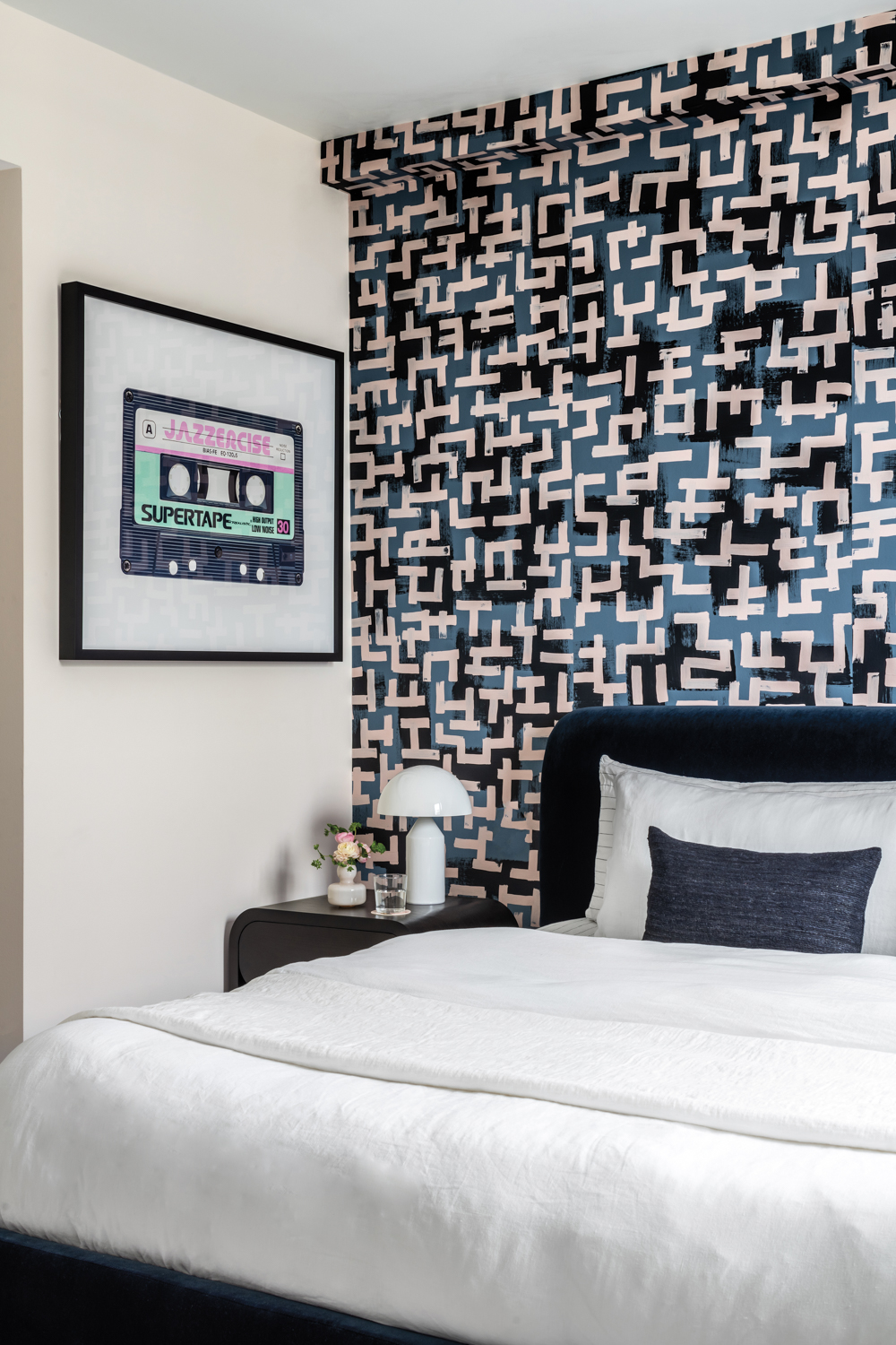 bedroom with geometric focus wall,...