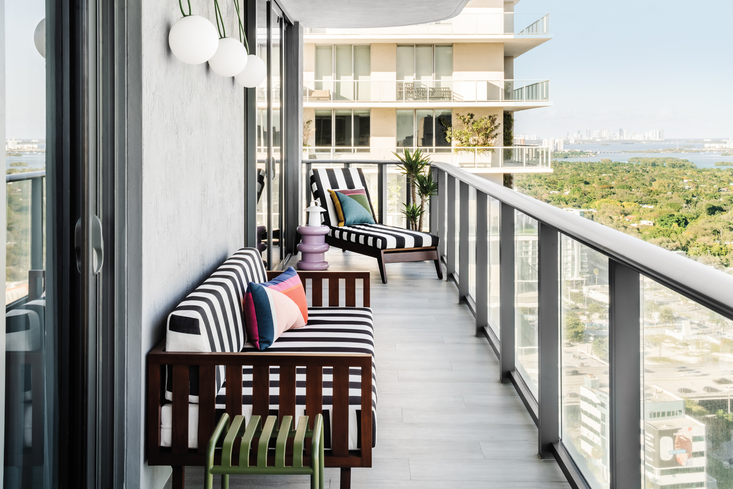 balcony with black-and-white striped futon...