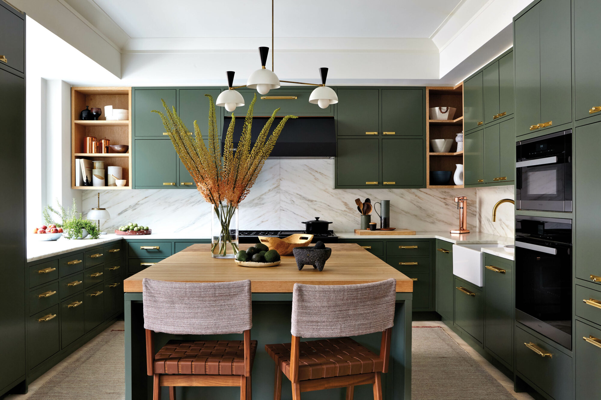 kitchen with green cabinetry, marble...