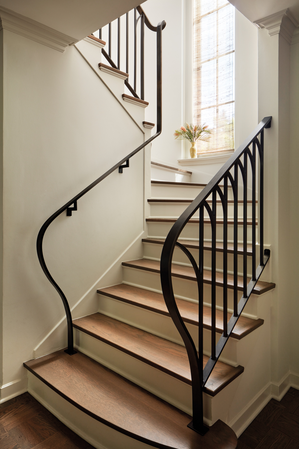 Stair with curving rail by...
