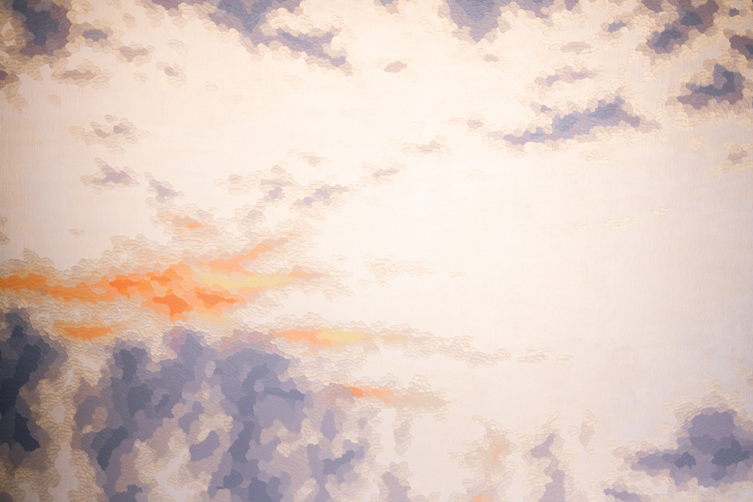 A painting depicts a colorful sky.