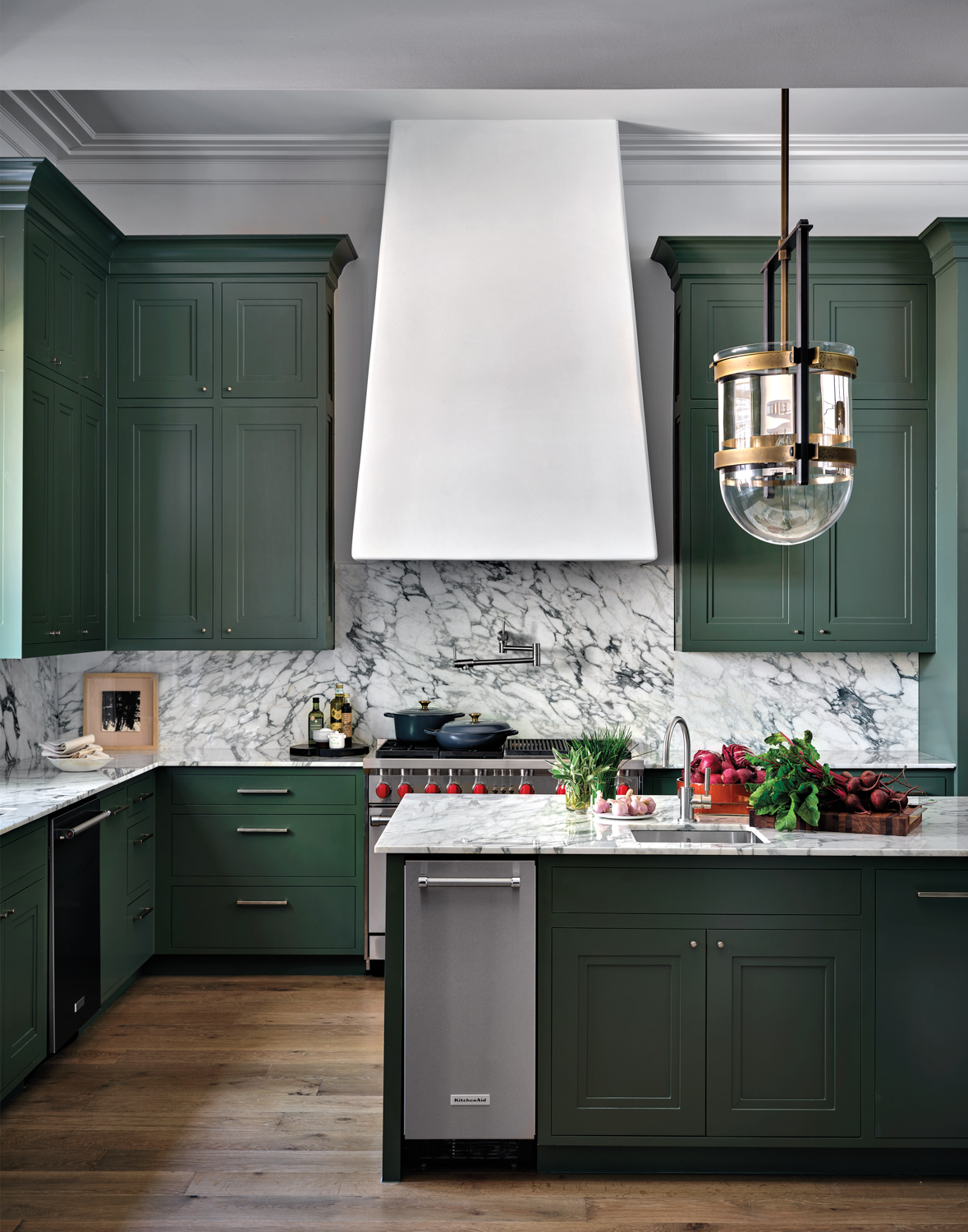 kitchen with green cabinetry and...