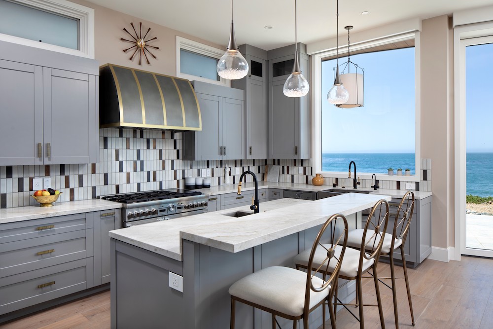 contemporary kitchen with views of the Pacific Ocean, pendant lighting and hard wood floors in Northern California home by De Mattei Construction