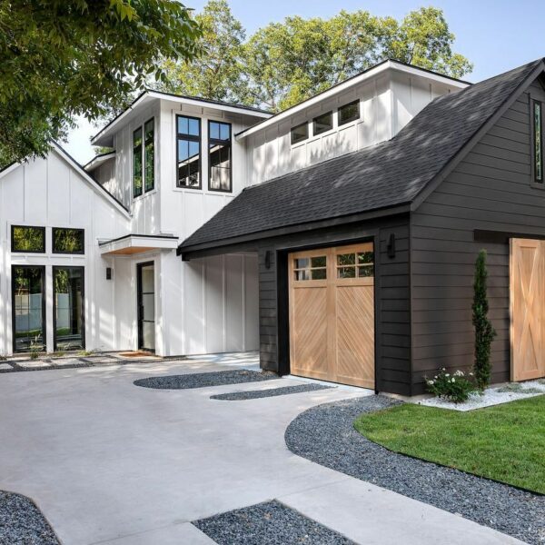 External farm home style home with black and white paint