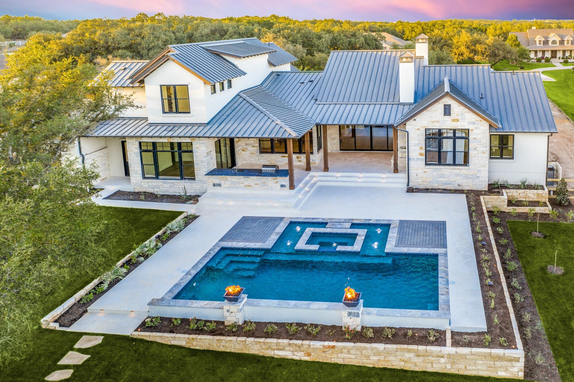 Aerial shot of home with pool in backyard