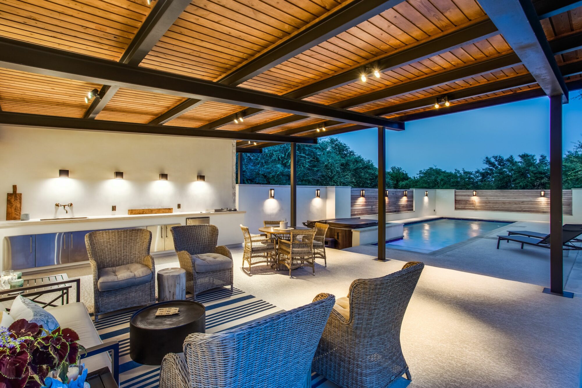 Outdoor covered living area with pool
