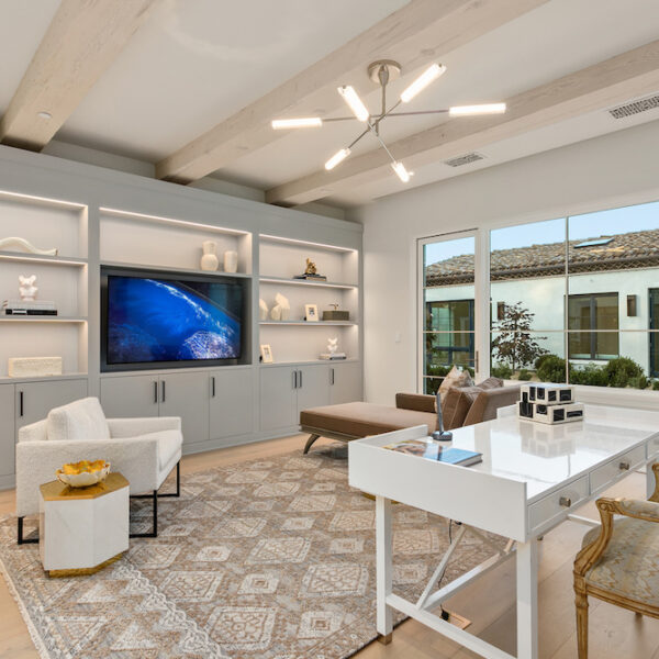 modern Southern California home office with built-in cabinets, white desk and chair.