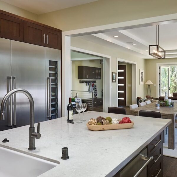 Interior design and architecture in Northern California kitchen with marble countertops and brown cabinets.