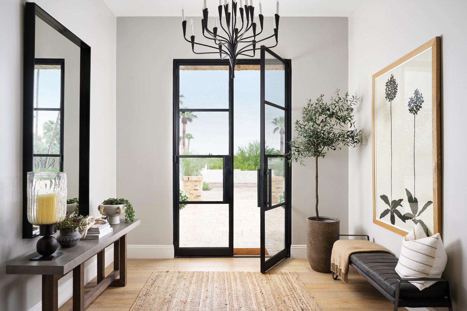 Foyer with glass-and-steel doors, modern...