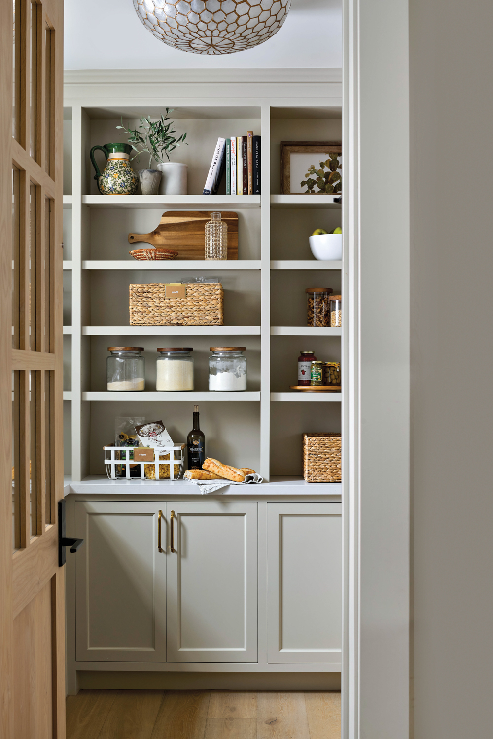 Pantry with built-in cabinetry and...