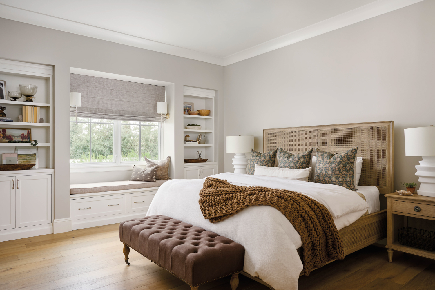 Light gray bedroom with a...