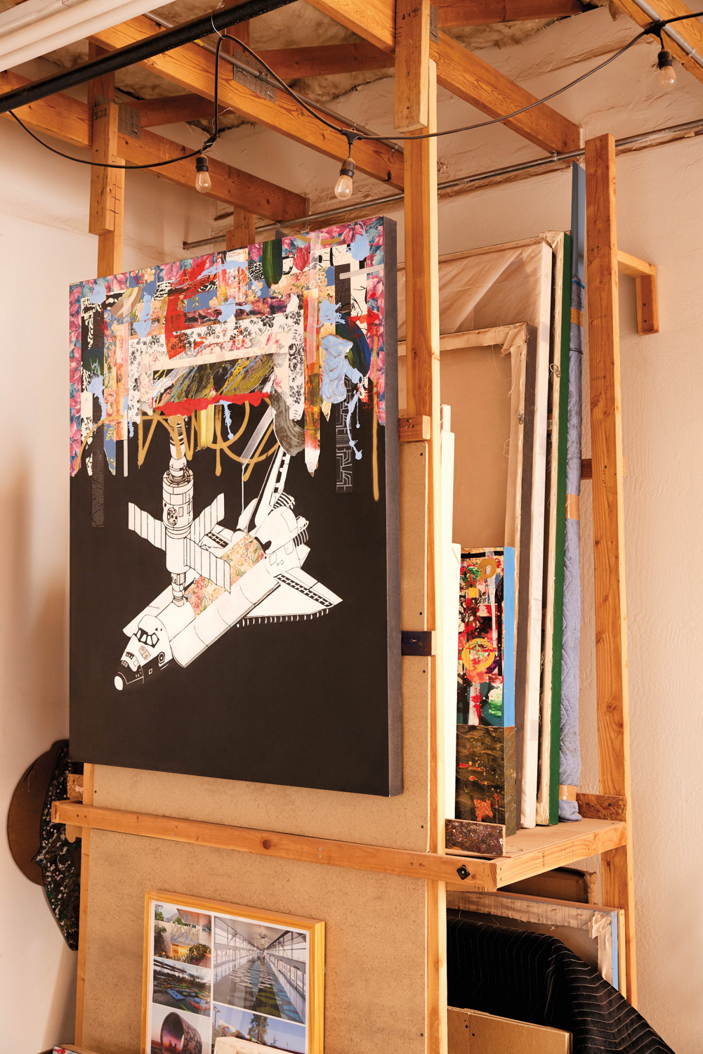 a painting of a machine on a black background with colorful collage on top