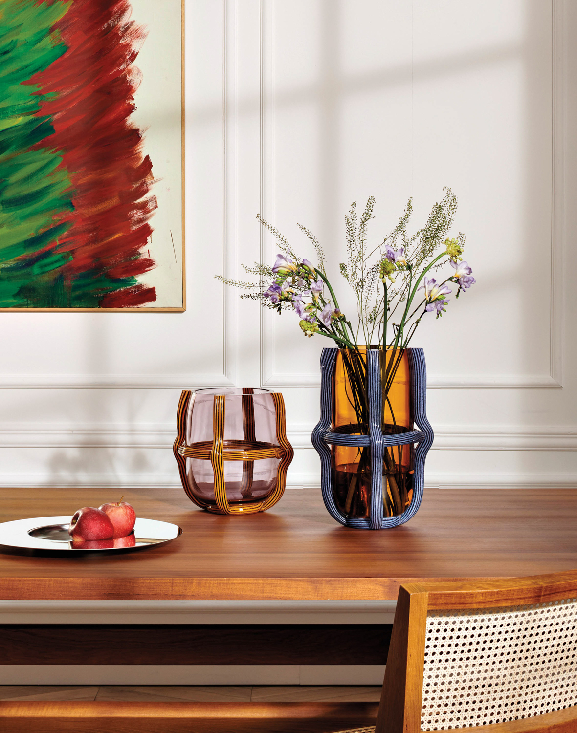 Glass-and-ceramic vases atop a wooden table