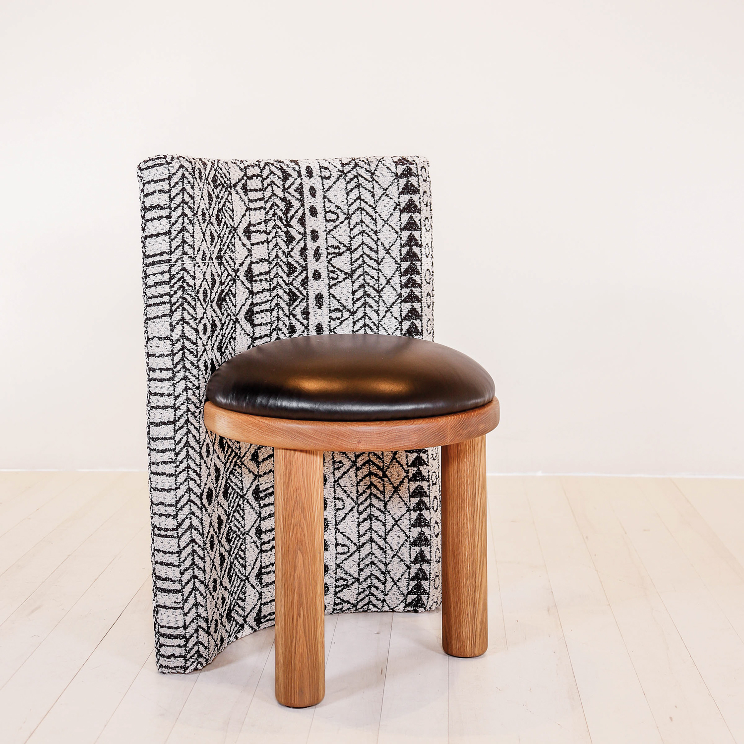 The SG Chair by Thomas Hayes and Samantha Gallagher, with a patterned-fabric back and a wood frame