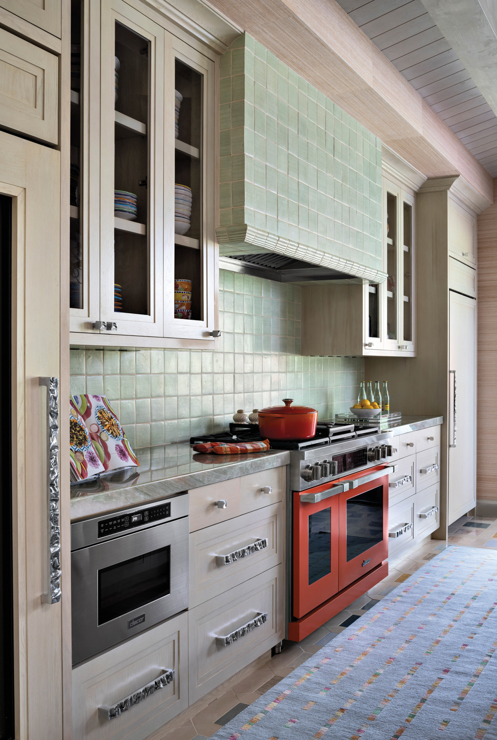 kitchen with light green tile...