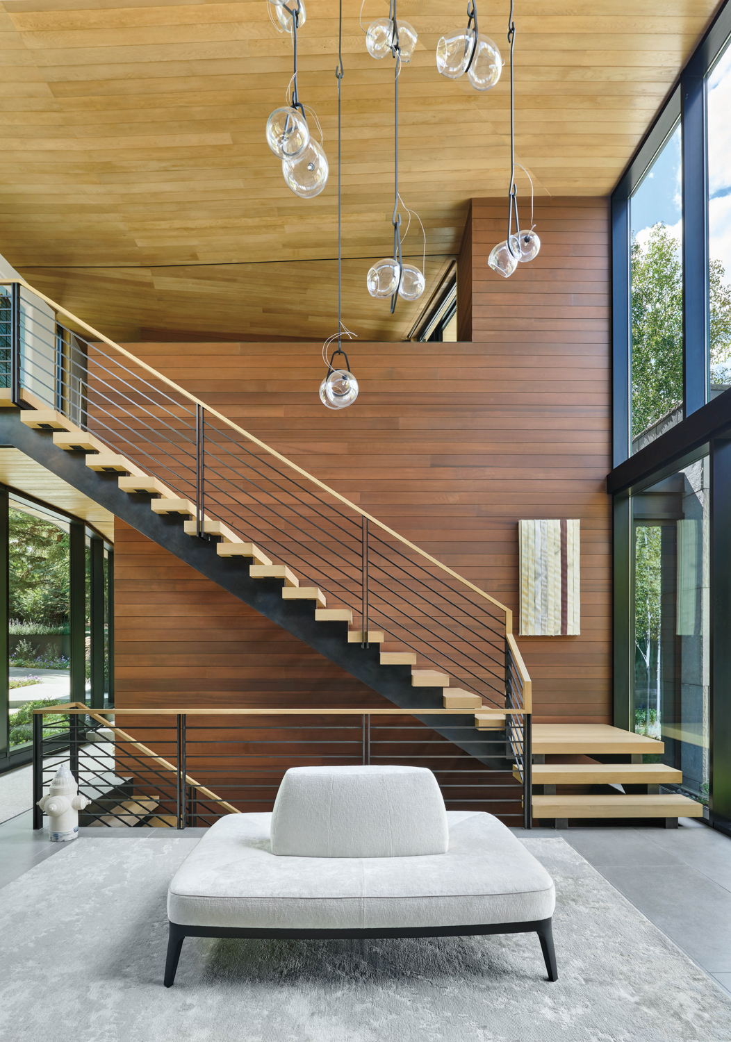 two-story foyer with steel and...