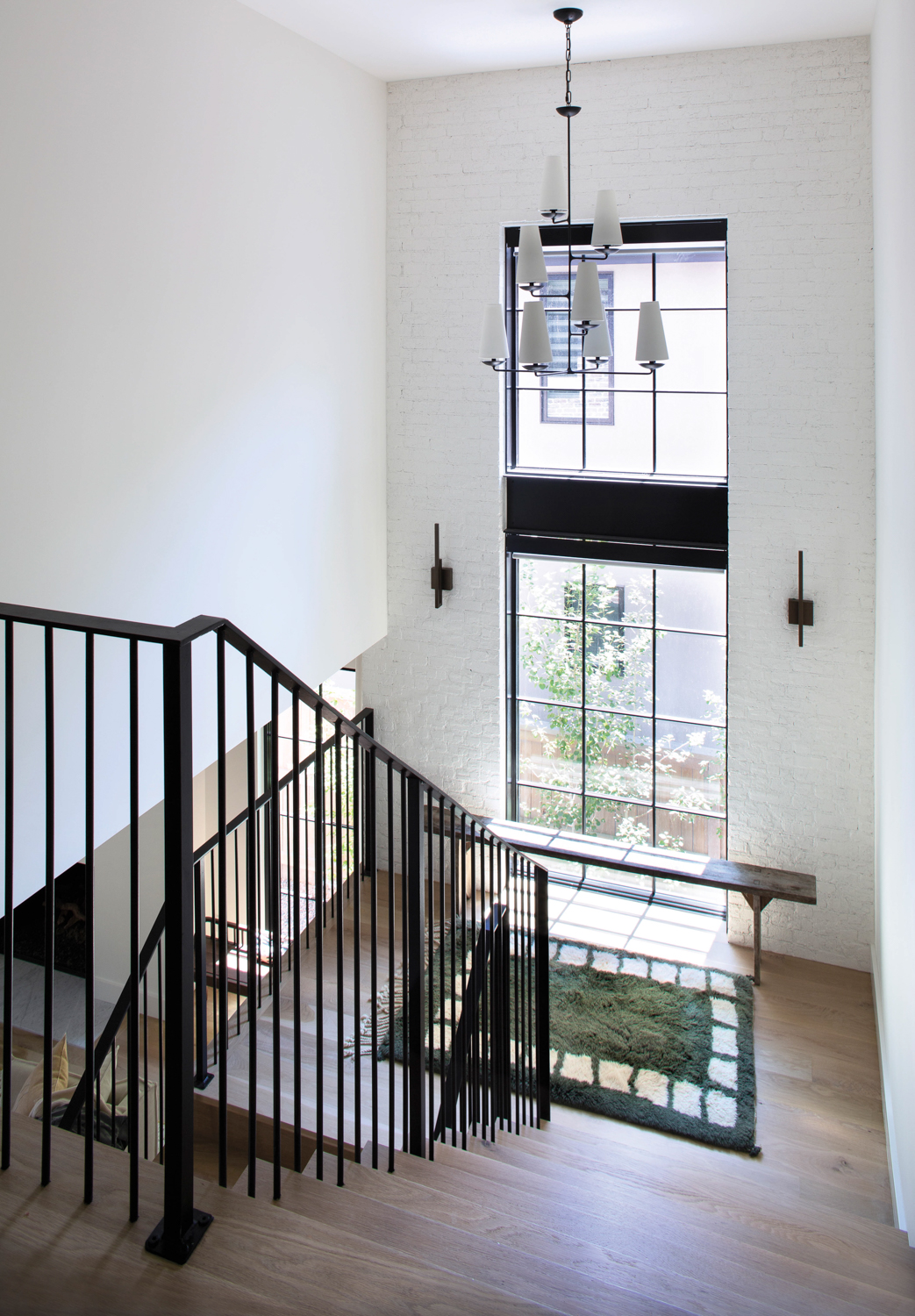 stairwell with black steel balusters...