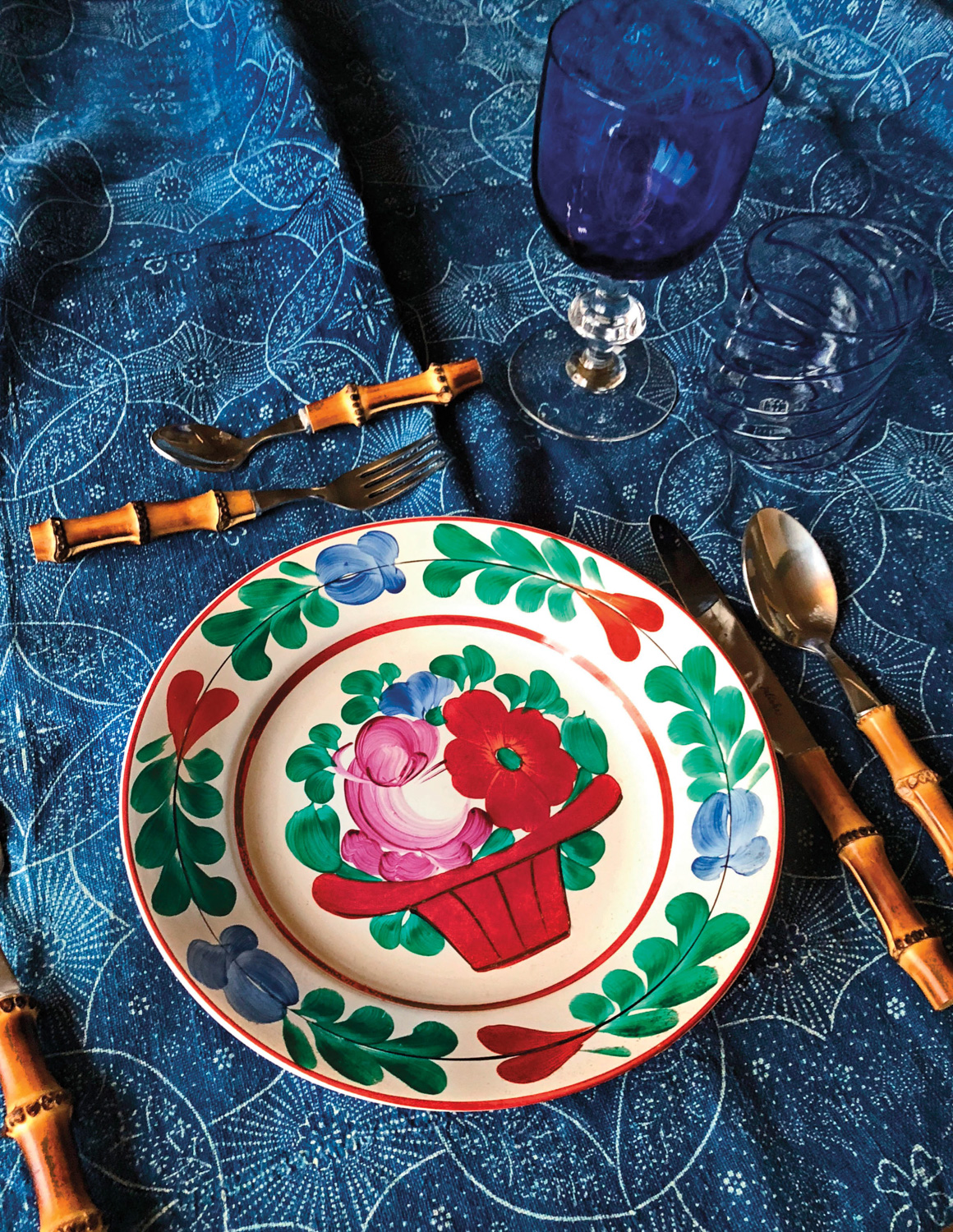 colorful and patterned tabletop with plate, linens and cutlery in book by Stephanie Stokes