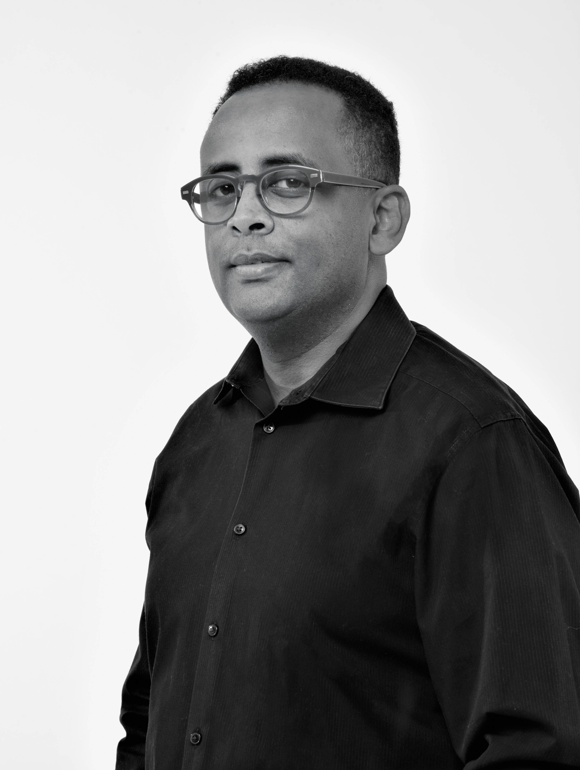 black and white portrait of BADG founder Jomo Tariku