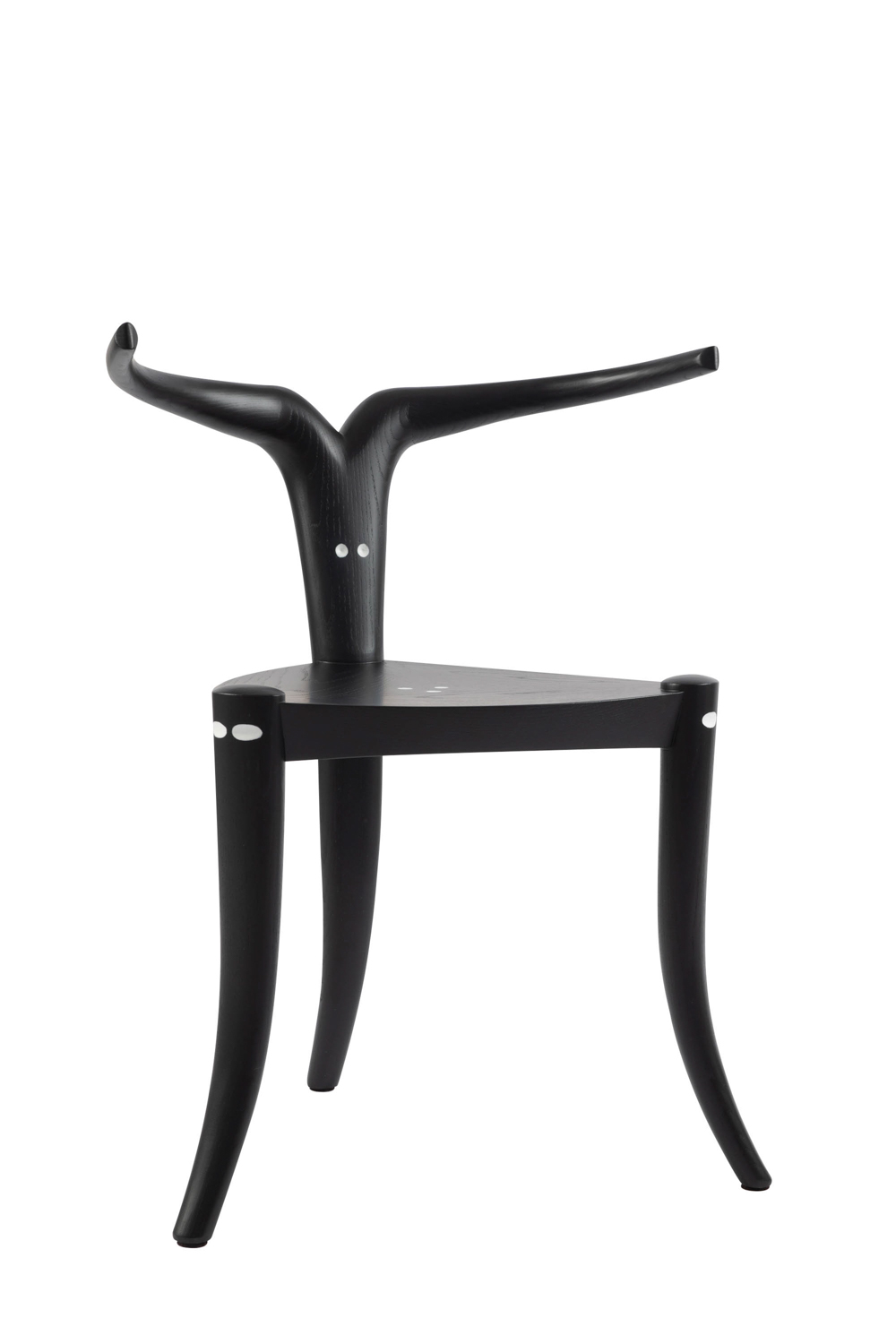 African inspired black table chairs with pointed legs and back