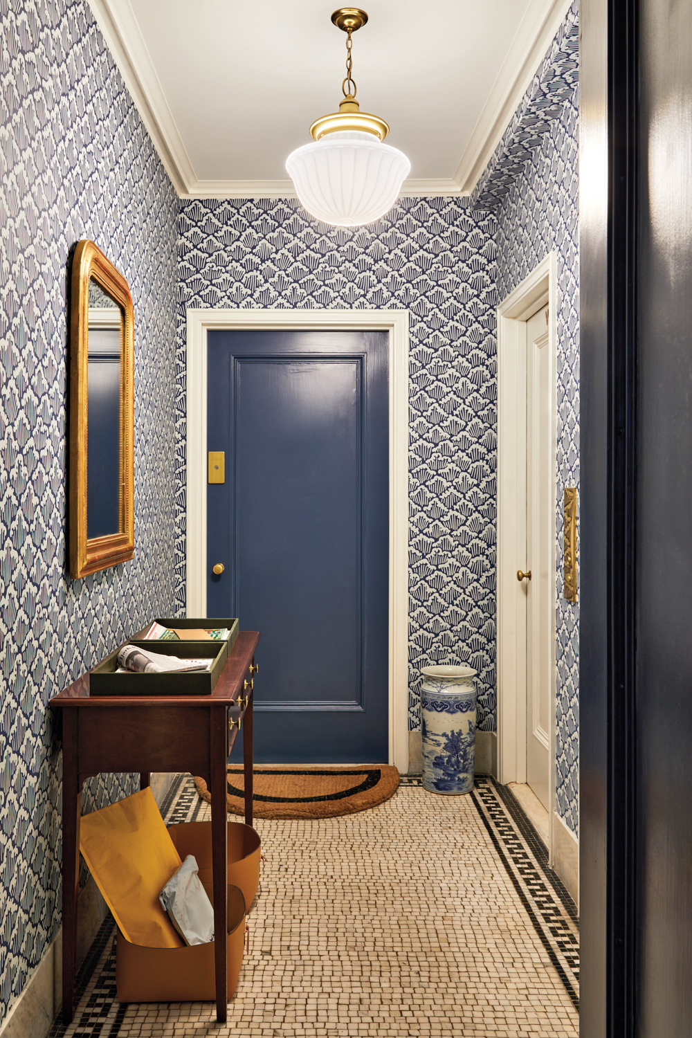 elevator foyer with blue wallpaper,...