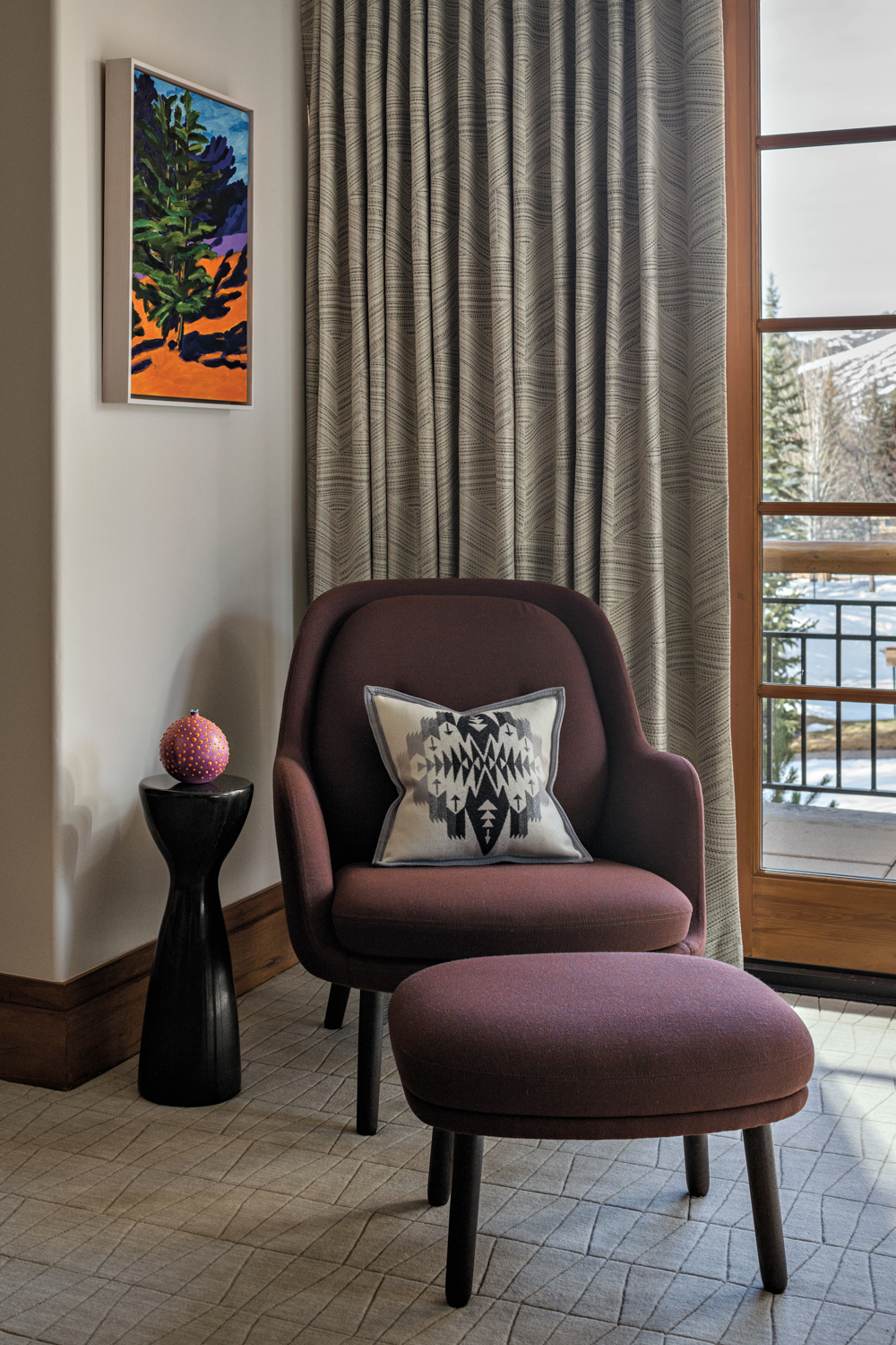 A plum colored armchair and...